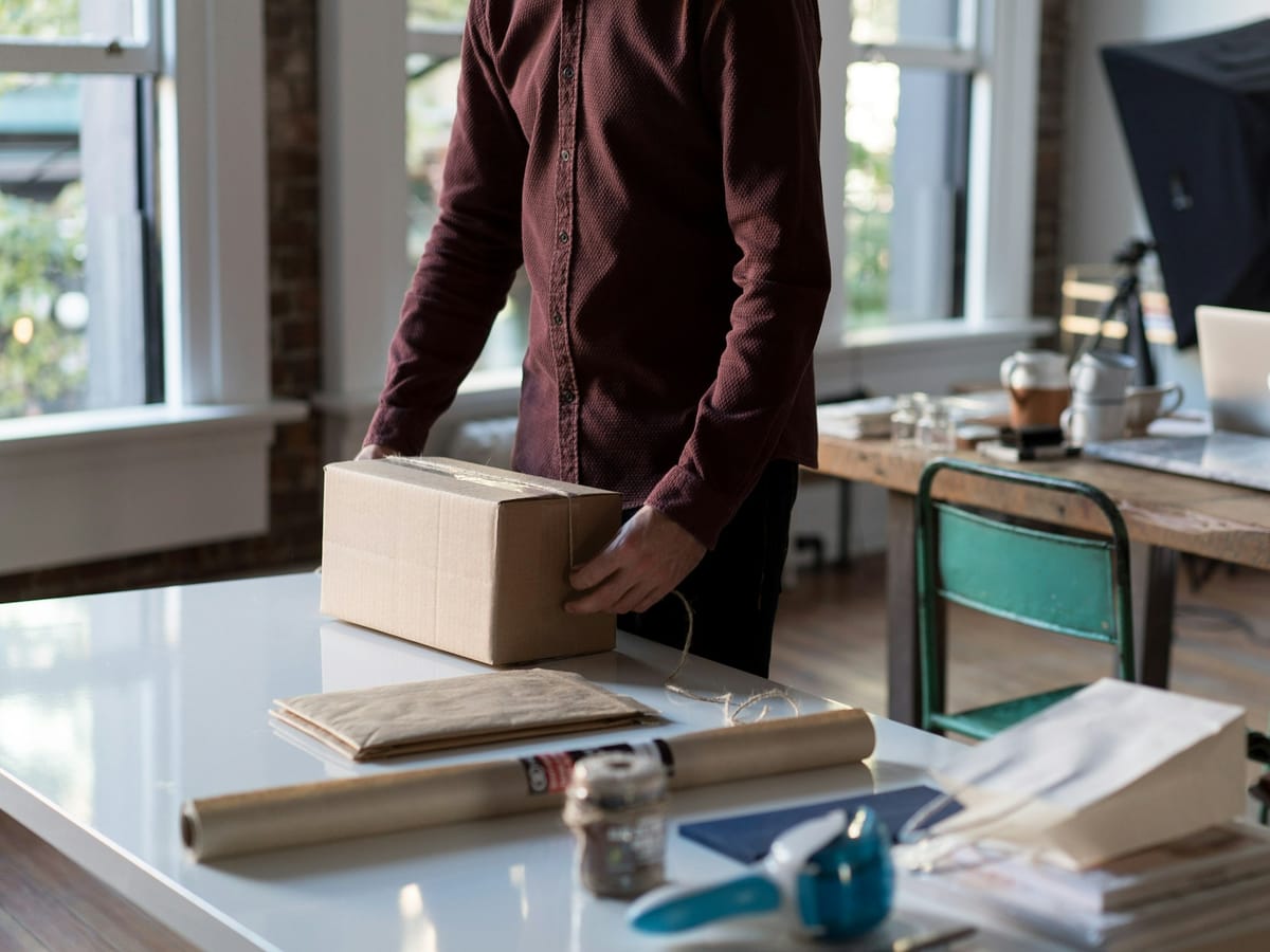 Parcel being prepared for shipping on a work table