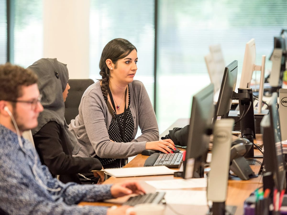 Support team handling requests at their desks